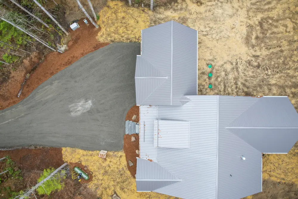 Dwight Beach Road from above, showing the standing seam steel roof that sheds pine needles