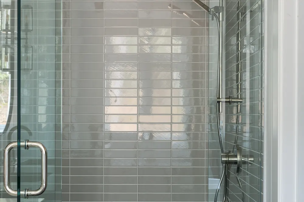 Glass shower with green tile at Dwight Beach Road