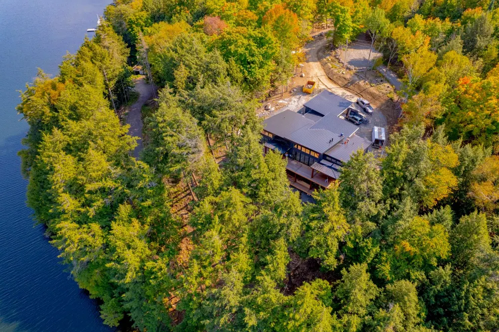 Aerial view of the Hemlock Point waterfront build on a wooded point in Muskoka
